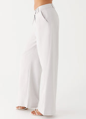 Womens Asha Low Rise Pants in the colour Ivory in front of a light grey background