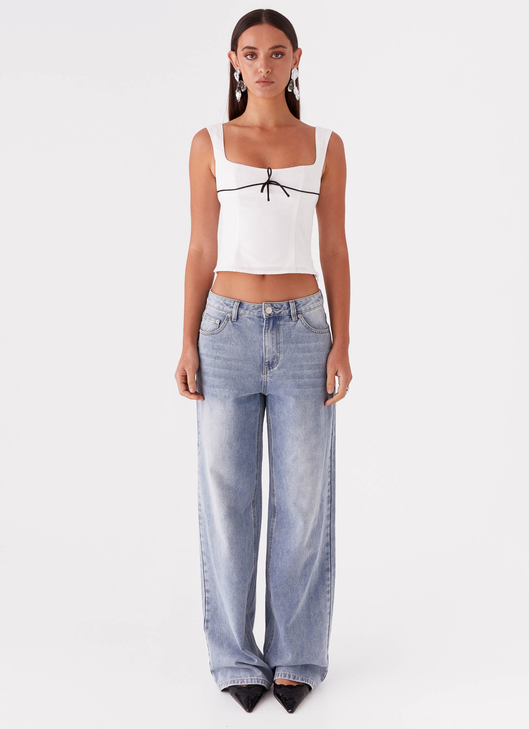 Womens Cadence Top in the colour White in front of a light grey background