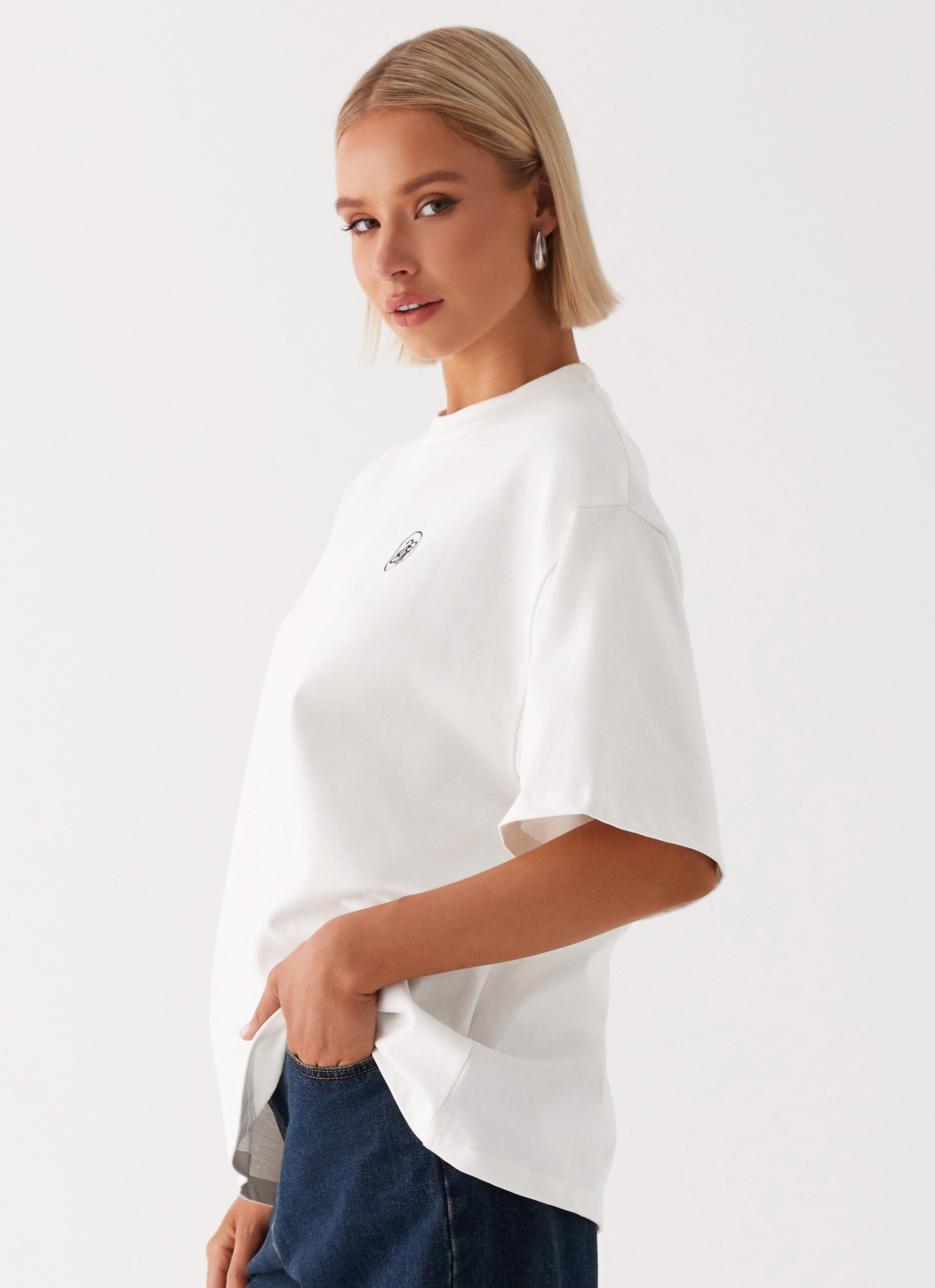 Womens Carefree Monogram Tin the colourShirt in the colour White in front of a light grey background