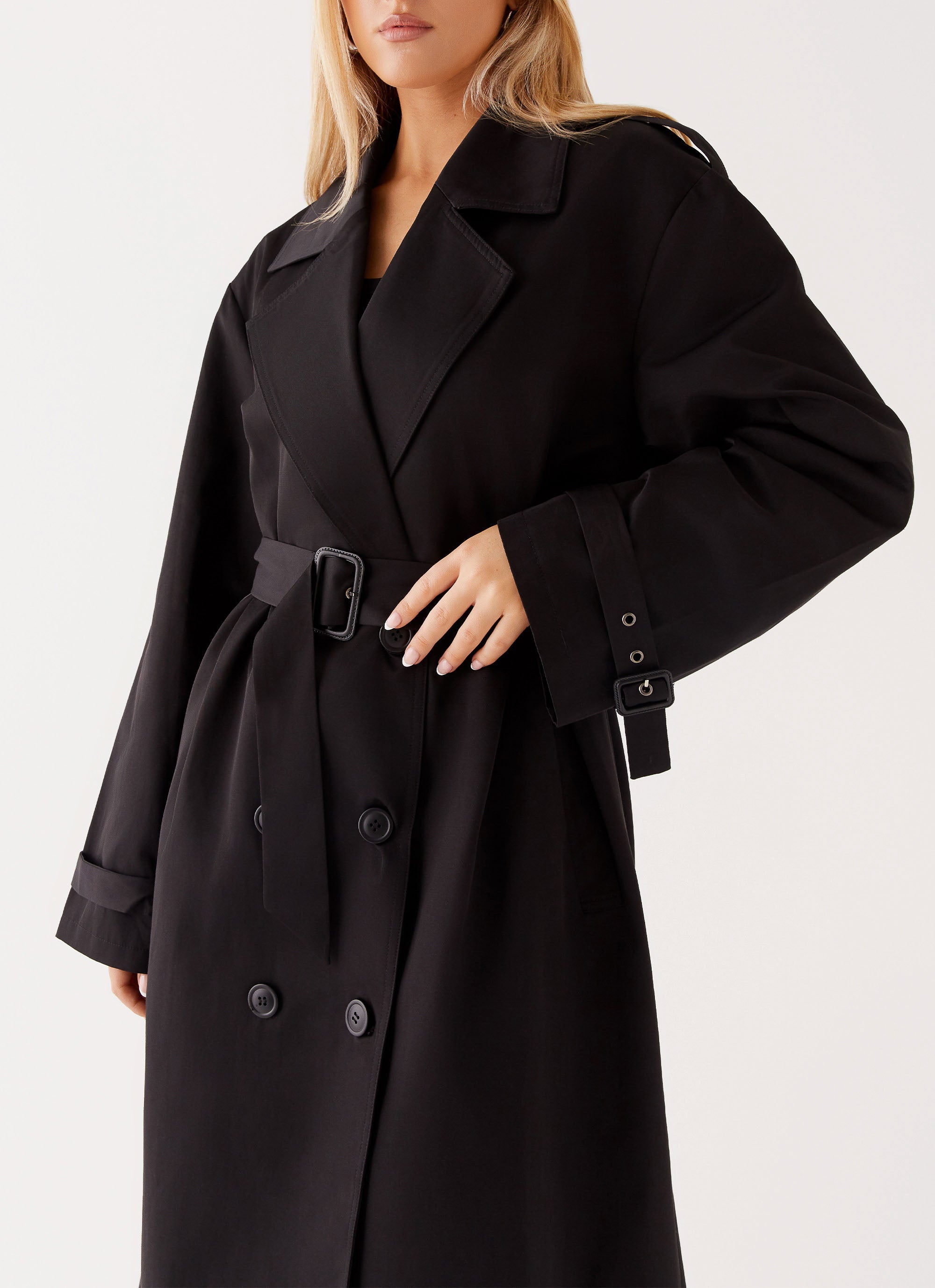 Womens Frenchy Oversized Trench Coat in the colour Black in front of a light grey background