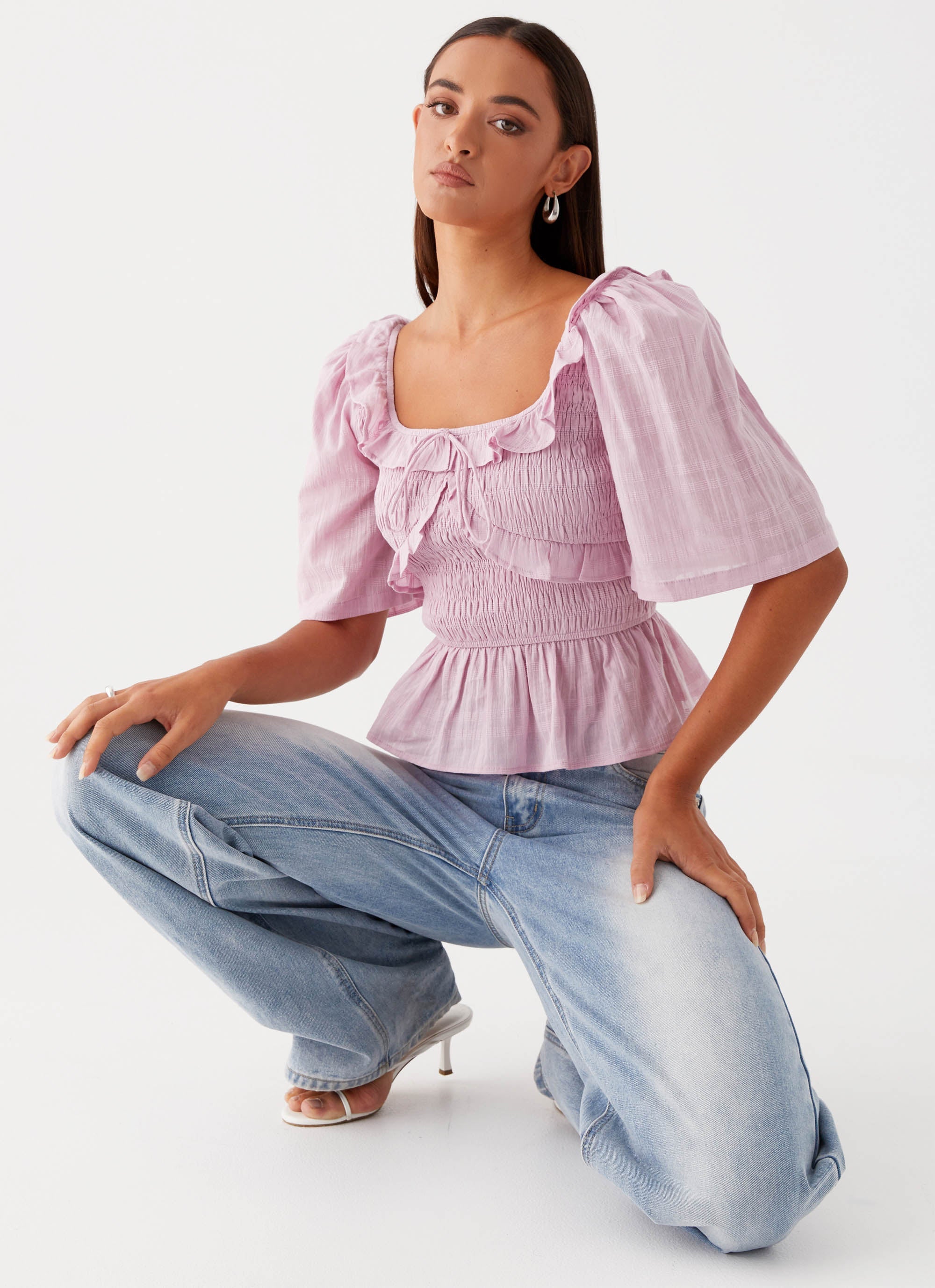 Womens Hidden Gem Shirring Top in the colour Purple in front of a light grey background