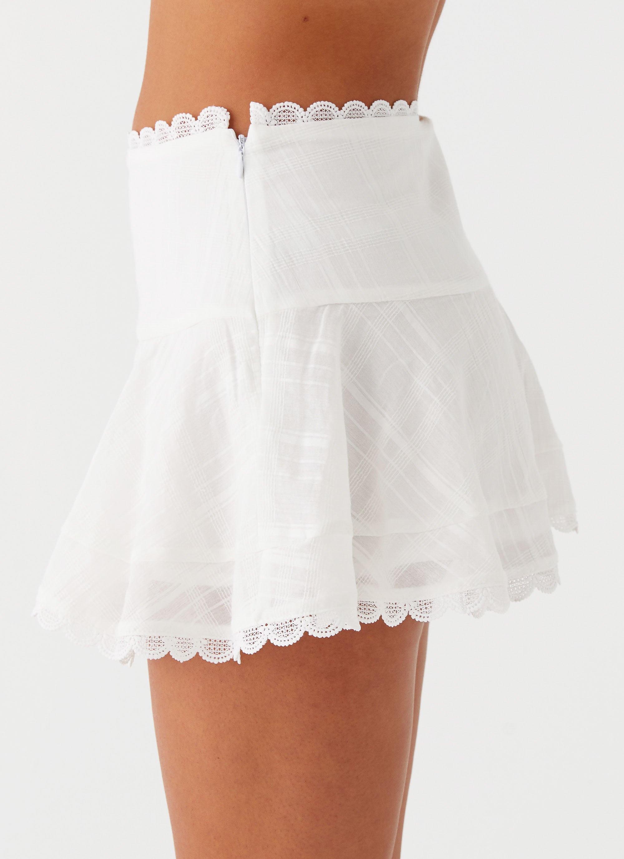 Womens Hundred Percent Mini Skirt in the colour White in front of a light grey background