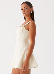 Womens Jamaya Tie Mini Dress in the colour Ivory in front of a light grey background