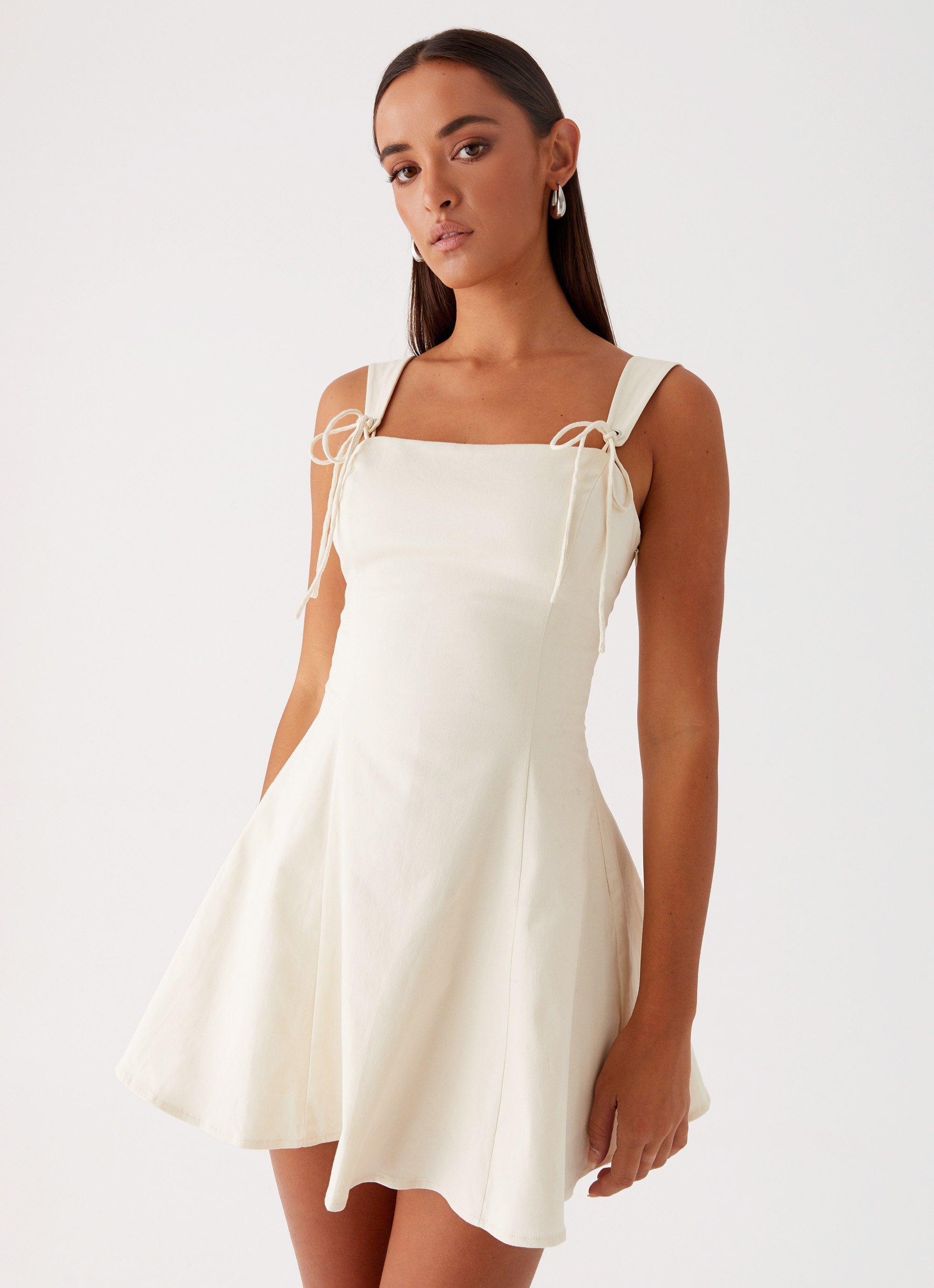 Womens Jamaya Tie Mini Dress in the colour Ivory in front of a light grey background
