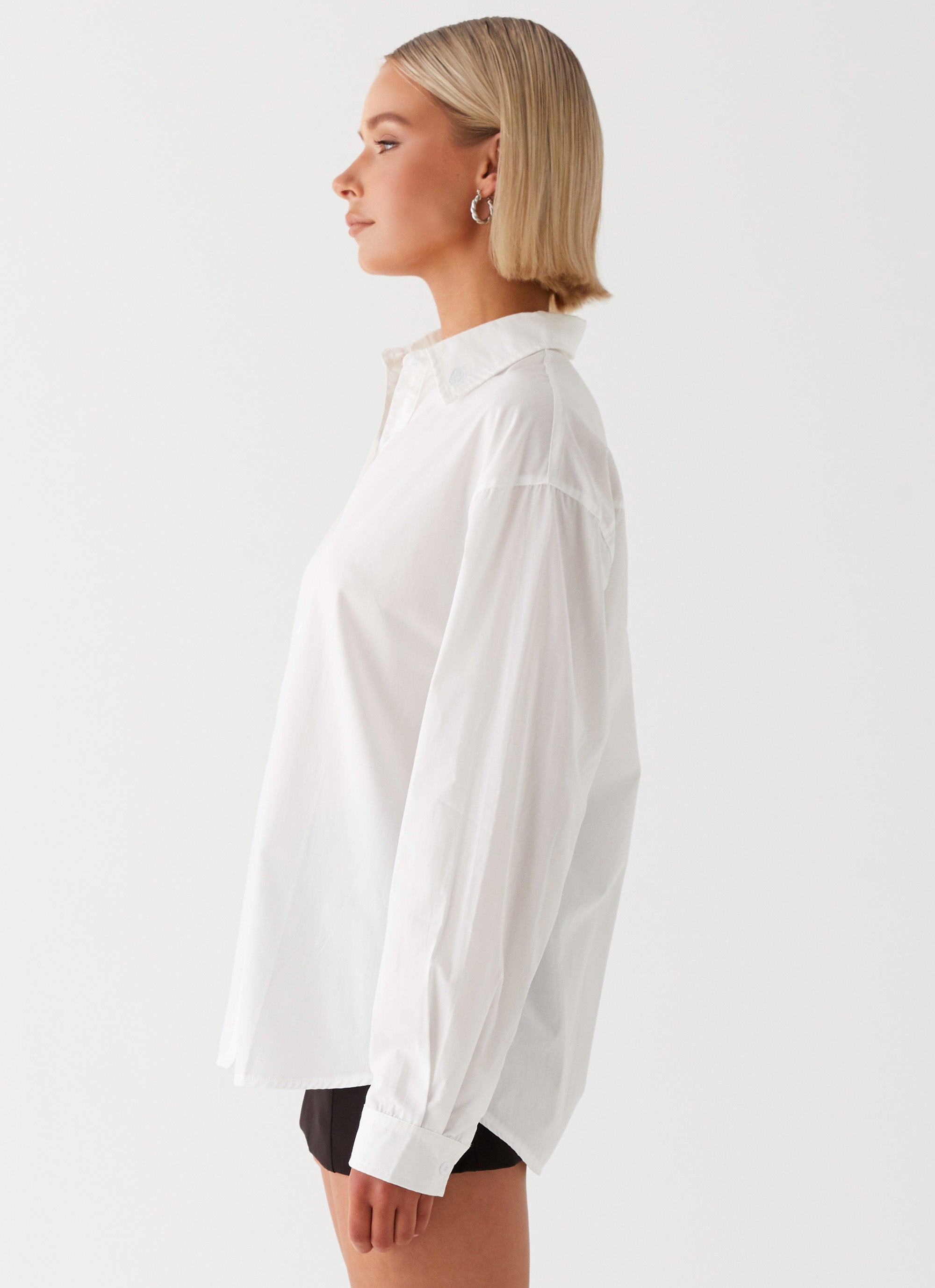 Womens Laurel Long Sleeve Oversized Shirt in the colour White in front of a light grey background