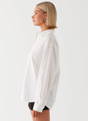 Womens Laurel Long Sleeve Oversized Shirt in the colour White in front of a light grey background