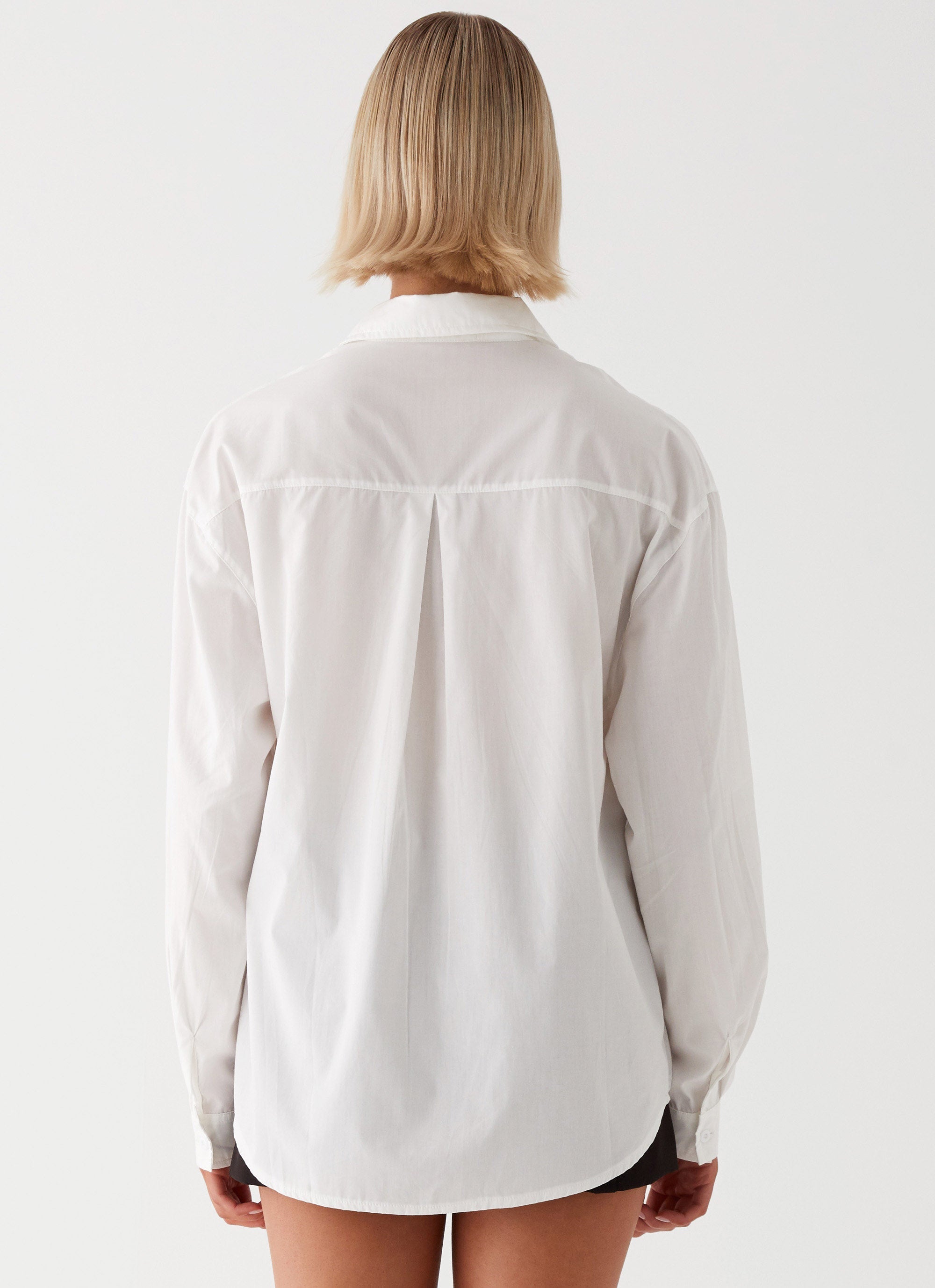 Womens Laurel Long Sleeve Oversized Shirt in the colour White in front of a light grey background