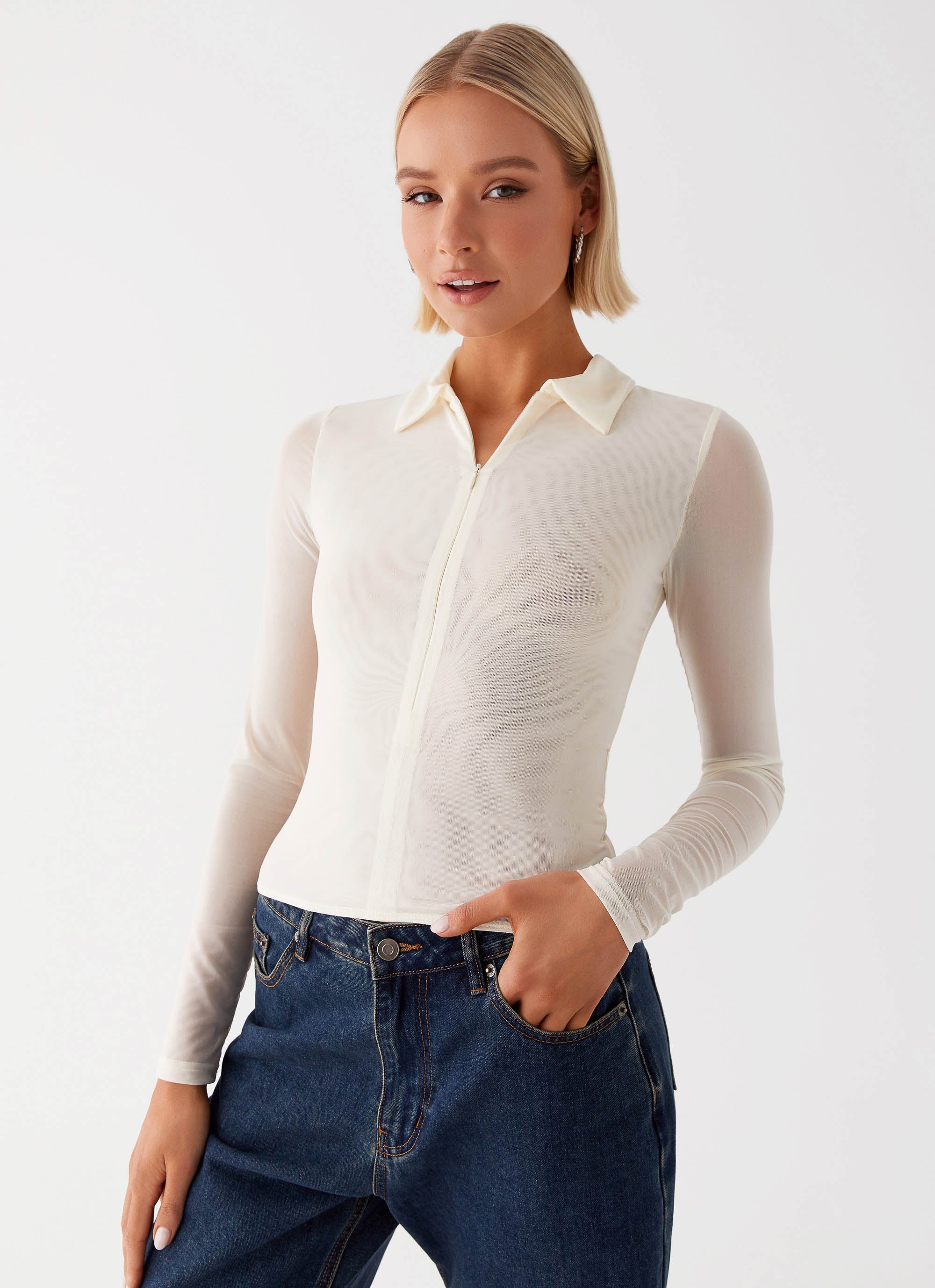 Womens Lorna Zip Up Shirt in the colour Ivory in front of a light grey background