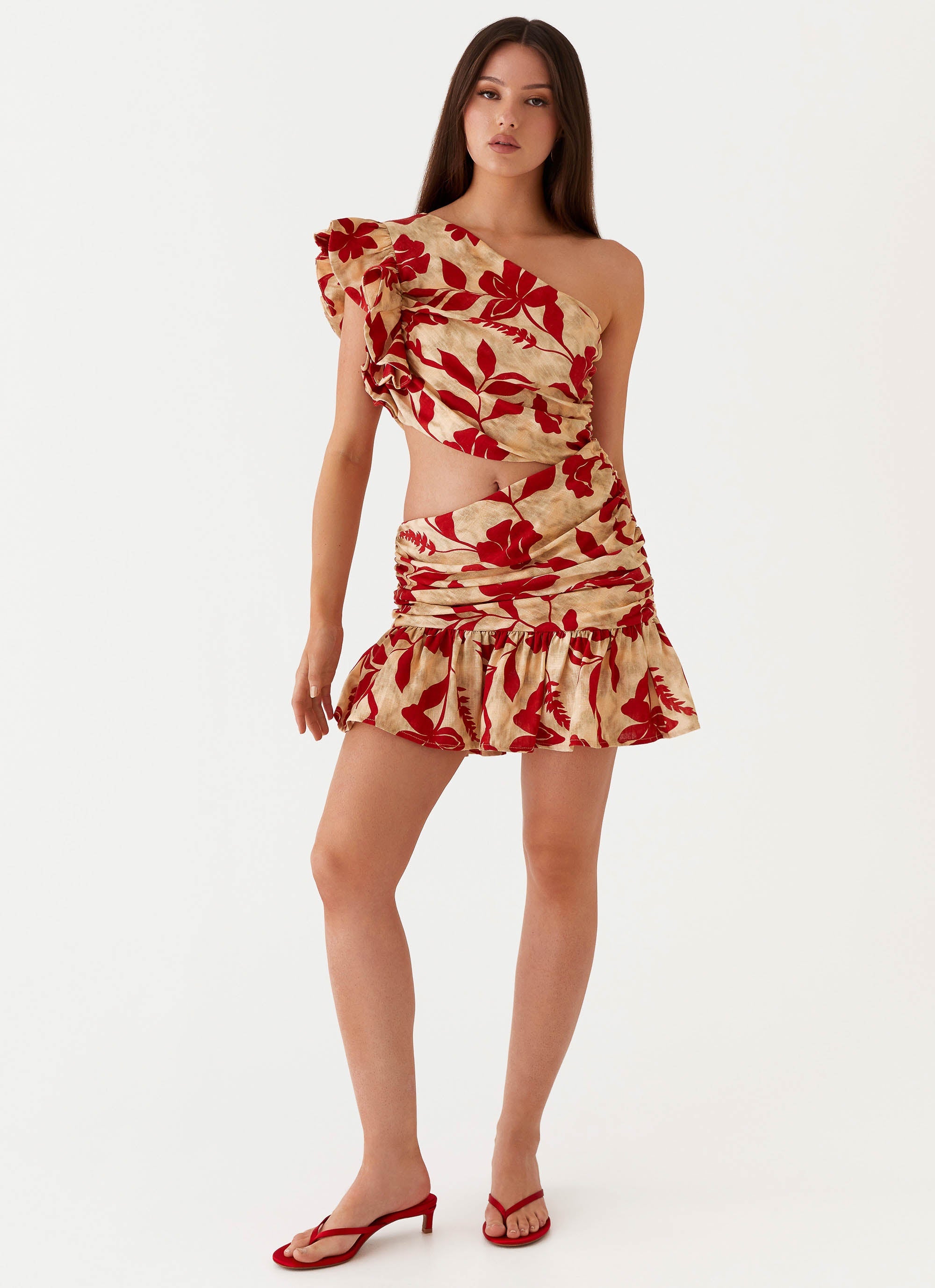 Womens Maisie Linen Mini Dress in the colour Red Green Floral in front of a light grey background