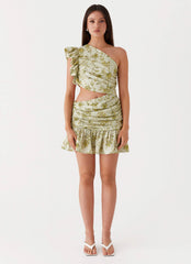 Womens Maisie Linen Mini Dress in the colour Sage Floral in front of a light grey background