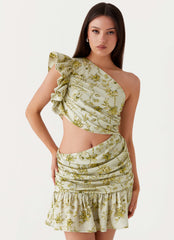 Womens Maisie Linen Mini Dress in the colour Sage Floral in front of a light grey background