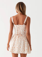 Womens Nash Bust Mini Dress in the colour White Ditsy Floral in front of a light grey background