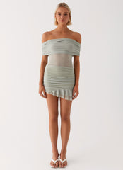 Womens Nelly Off Shoulder Mini Dress in the colour Pistachio in front of a light grey background