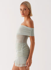 Womens Nelly Off Shoulder Mini Dress in the colour Pistachio in front of a light grey background