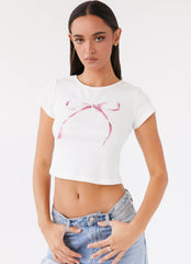 Womens Rosalind Baby Tee in the colour White in front of a light grey background