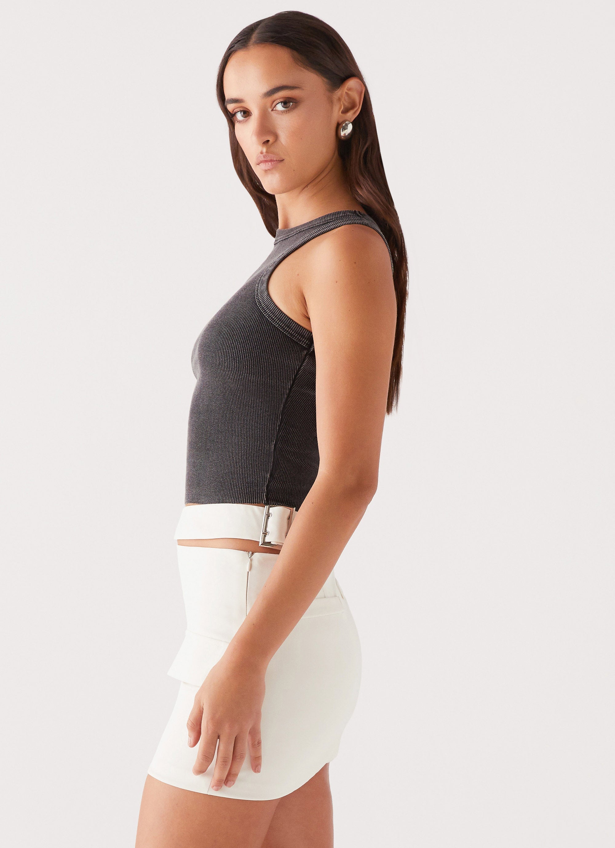 Womens Danger Zone Cut Out Mini Skirt in the colour Ivory in front of a light grey background