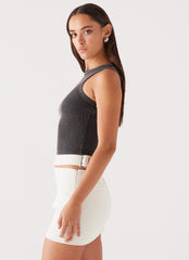 Womens Danger Zone Cut Out Mini Skirt in the colour Ivory in front of a light grey background
