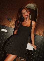 Womens Evelyn Mini Dress in the colour Black in front of a light grey background