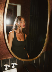 Womens Evelyn Mini Dress in the colour Black in front of a light grey background