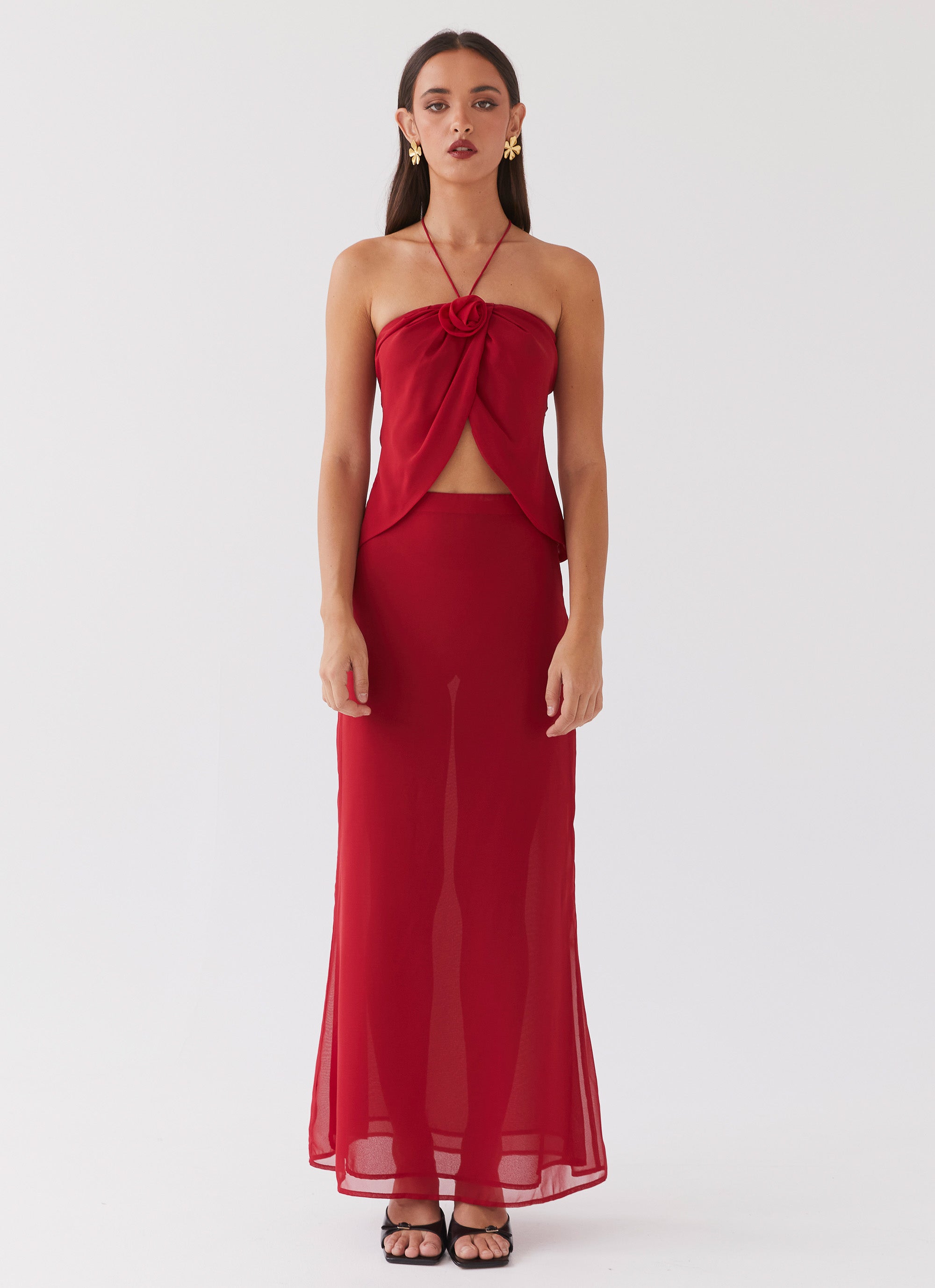 Womens Nightfall Maxi Skirt in the colour Rouge Red in front of a light grey background