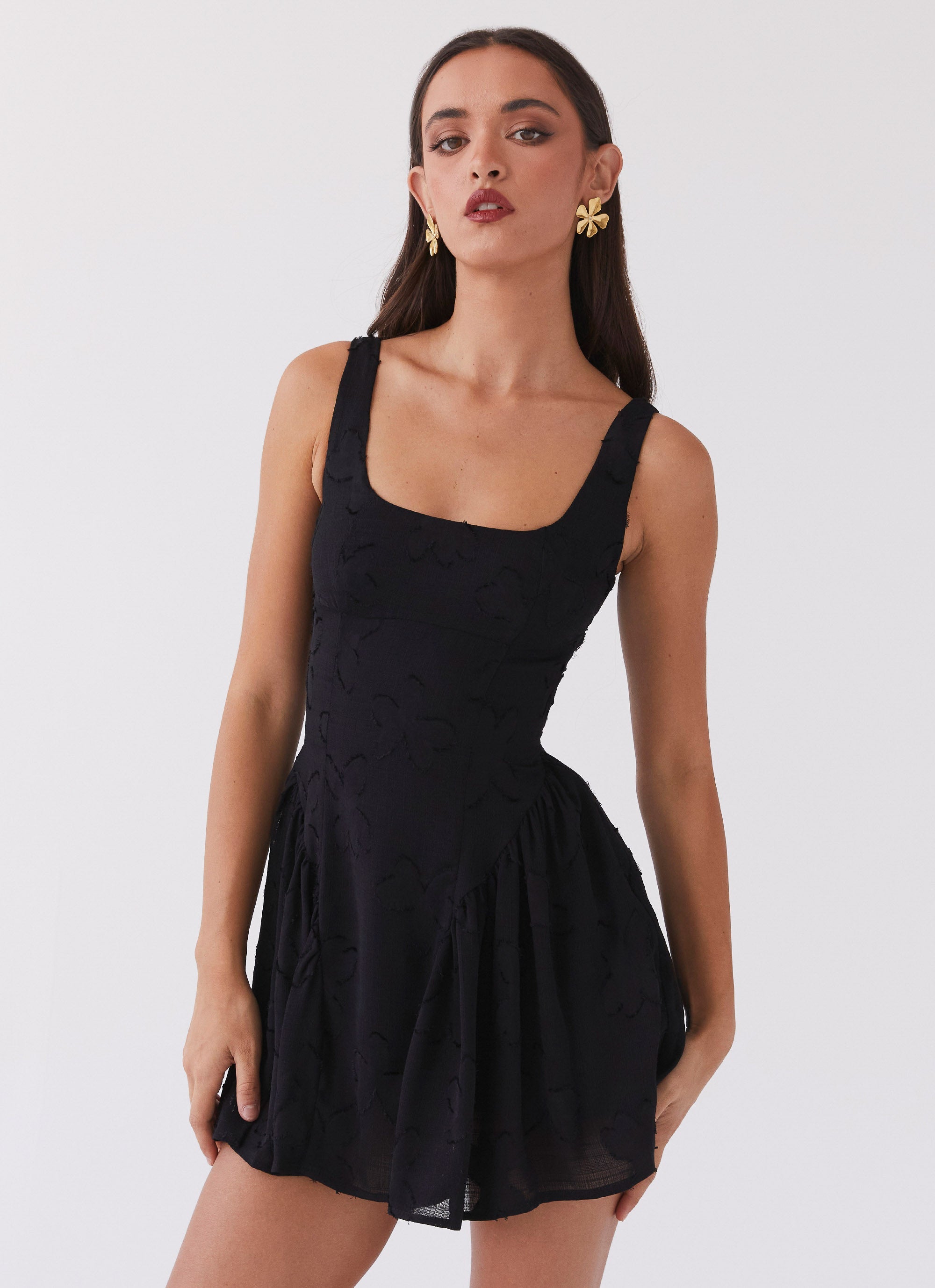 Womens Evelyn Mini Dress in the colour Black in front of a light grey background