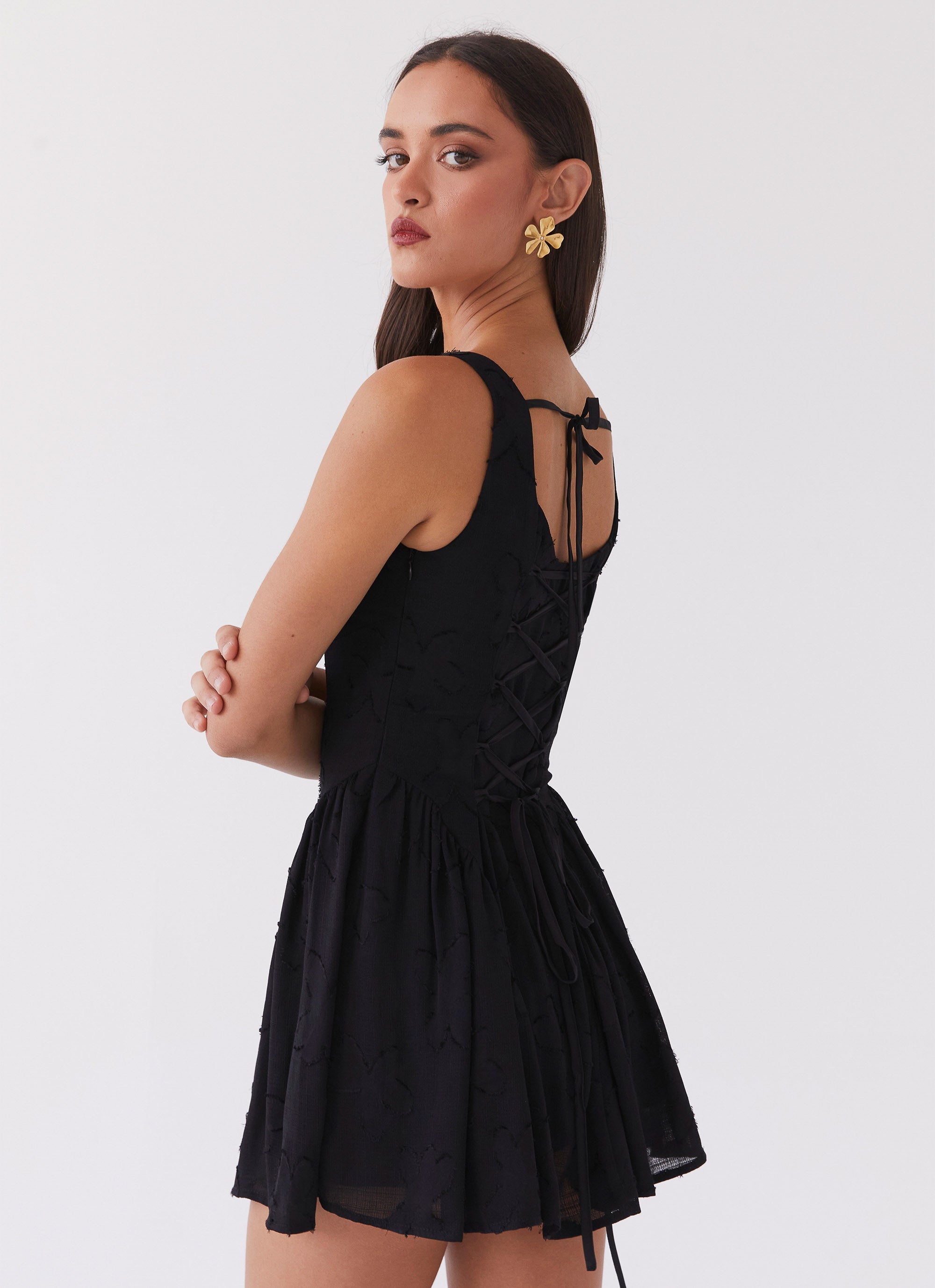 Womens Evelyn Mini Dress in the colour Black in front of a light grey background