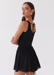 Womens Evelyn Mini Dress in the colour Black in front of a light grey background