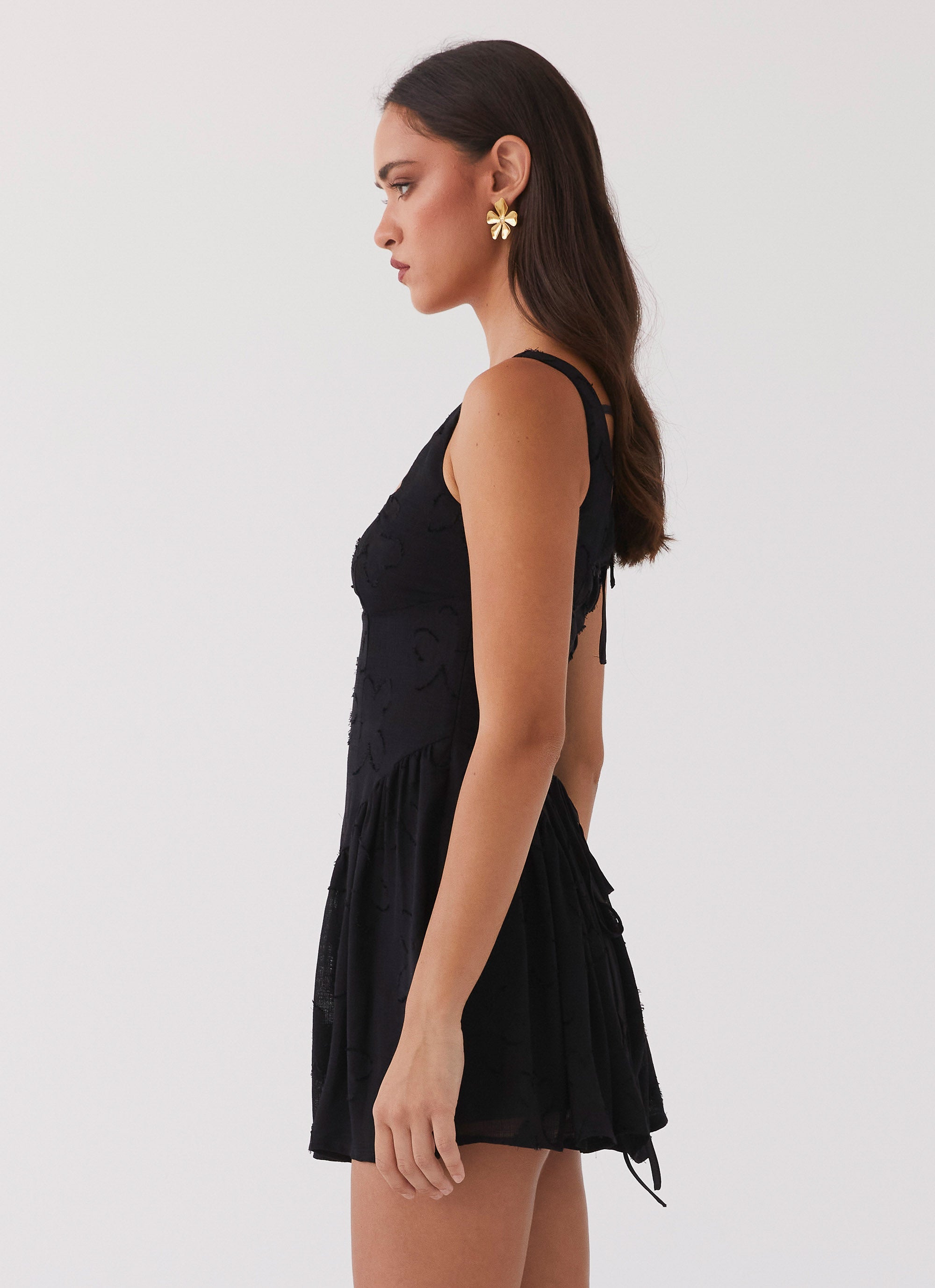 Womens Evelyn Mini Dress in the colour Black in front of a light grey background