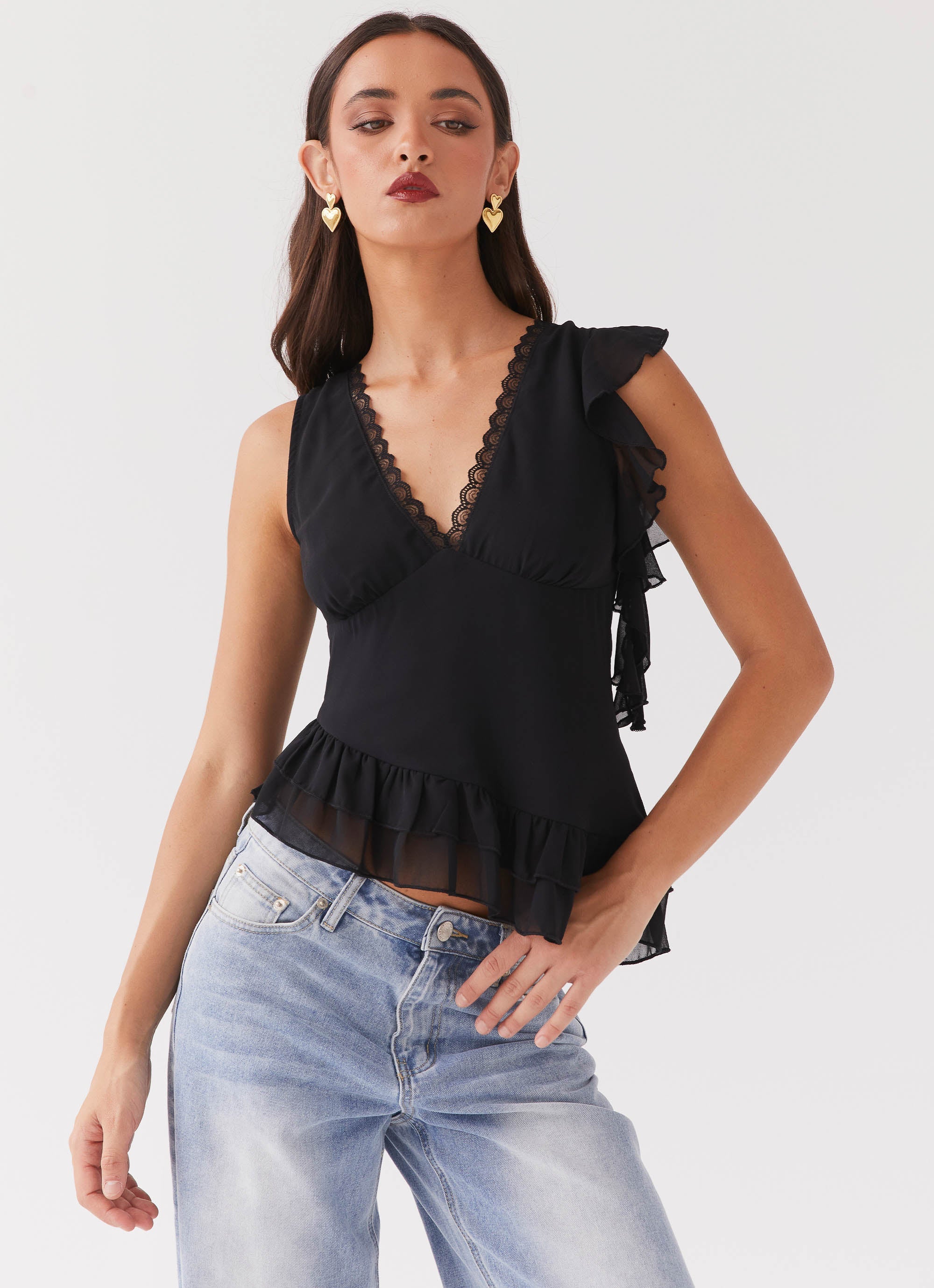 Womens Empress Frill Trim Top in the colour Black in front of a light grey background
