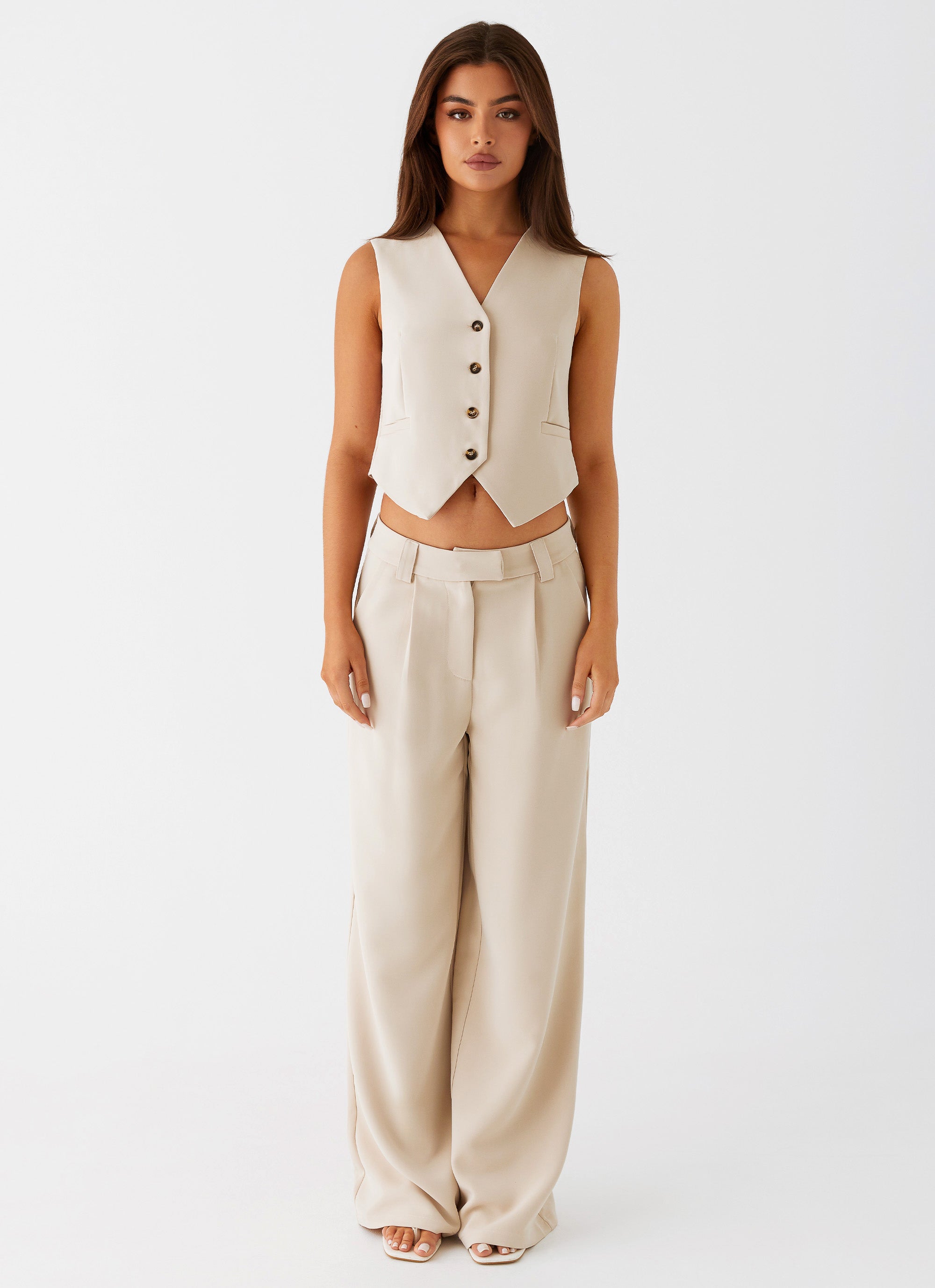 Womens Midnight City Suit Pants in the colour Beige in front of a light grey background