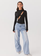 Womens Special Affair Long Sleeve Bodysuit in the colour Black in front of a light grey background