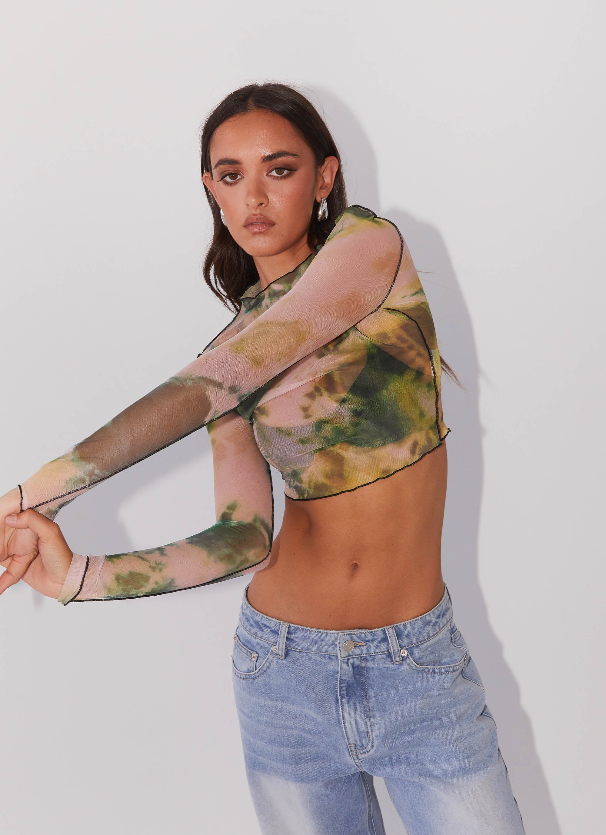 Womens Neon Serenade Mesh Long Sleeve Top in the colour Rainforest in front of a light grey background