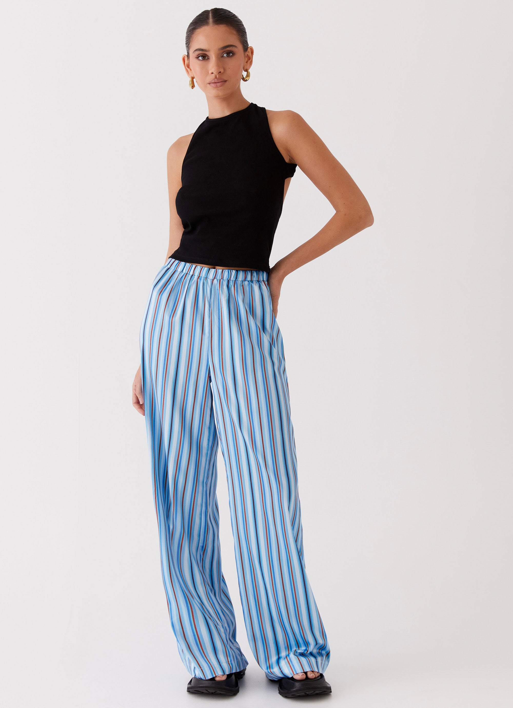 Womens Salta Satin Pants in the colour Blue Stripe in front of a light grey background