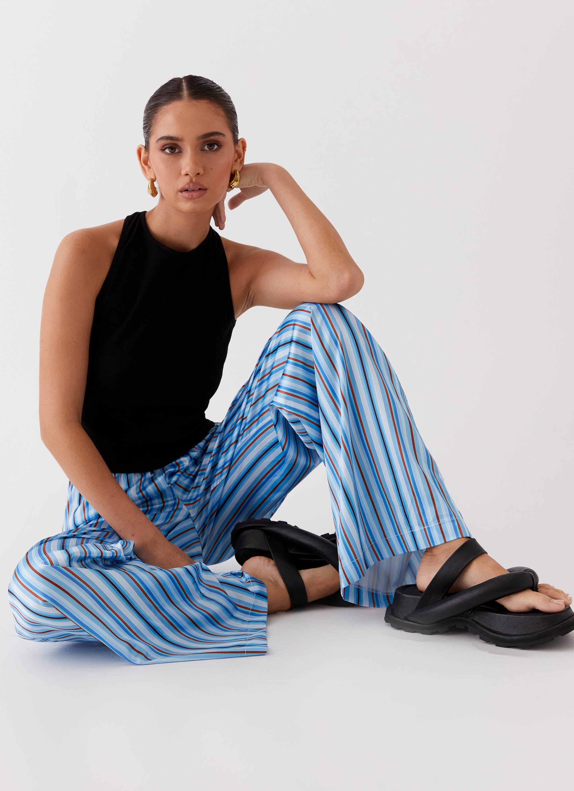 Womens Salta Satin Pants in the colour Blue Stripe in front of a light grey background