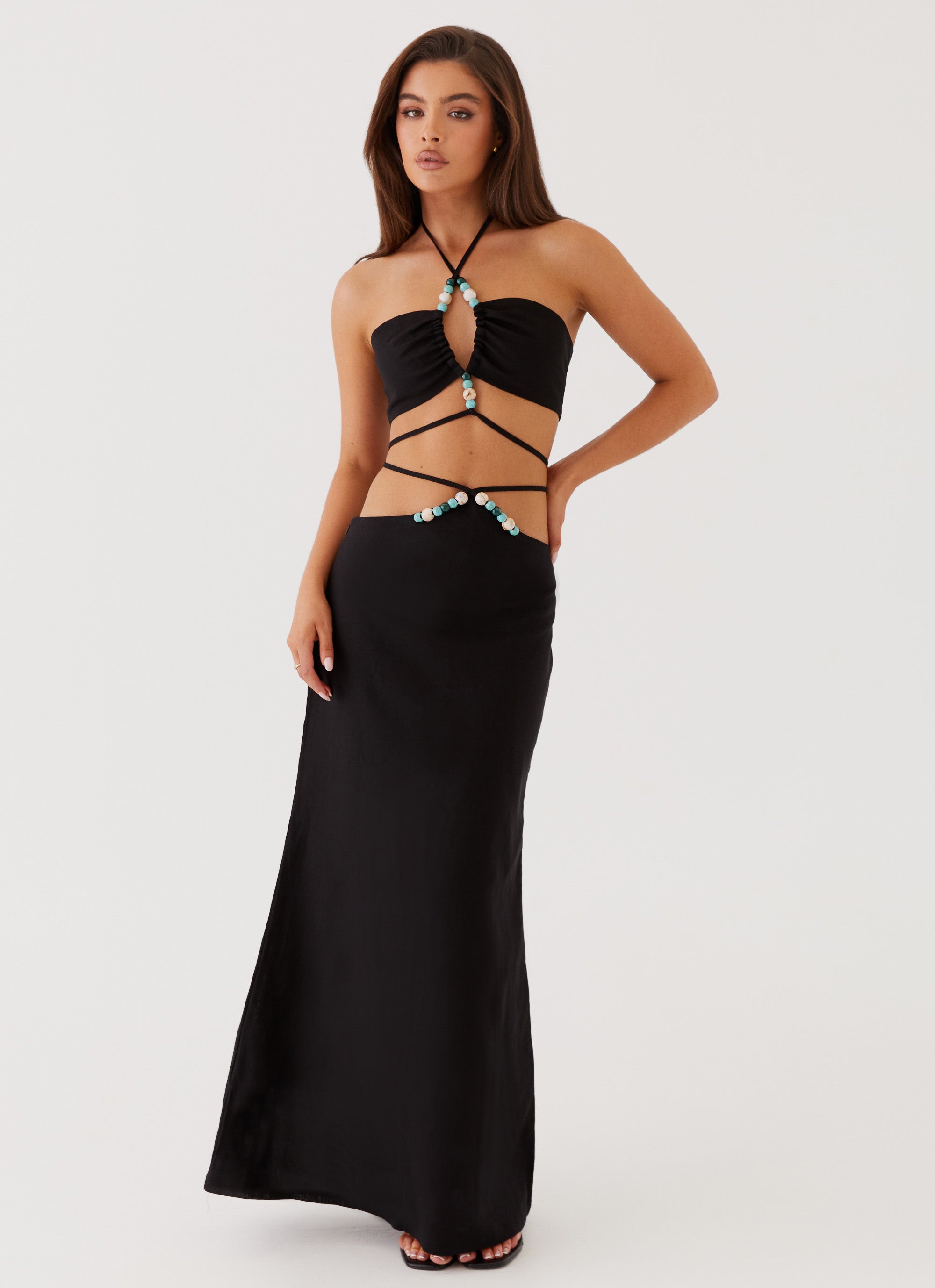 Womens Neveah Beaded Halter Top in the colour Black in front of a light grey background