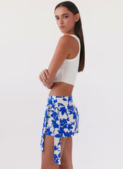 Womens Steal Away Linen Wrap Skirt in the colour Blue Floral in front of a light grey background