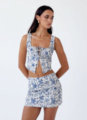 Womens Take Me Away Mini Skirt in the colour Blue Paisley in front of a light grey background
