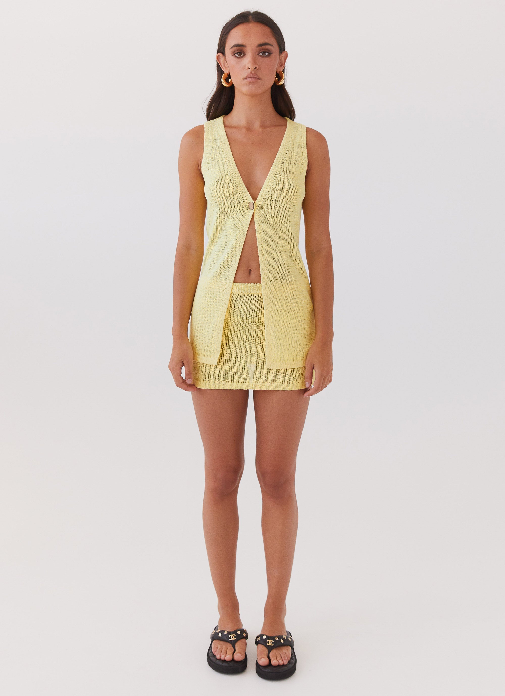 Womens Capri Glow Knit Top in the colour Canary in front of a light grey background