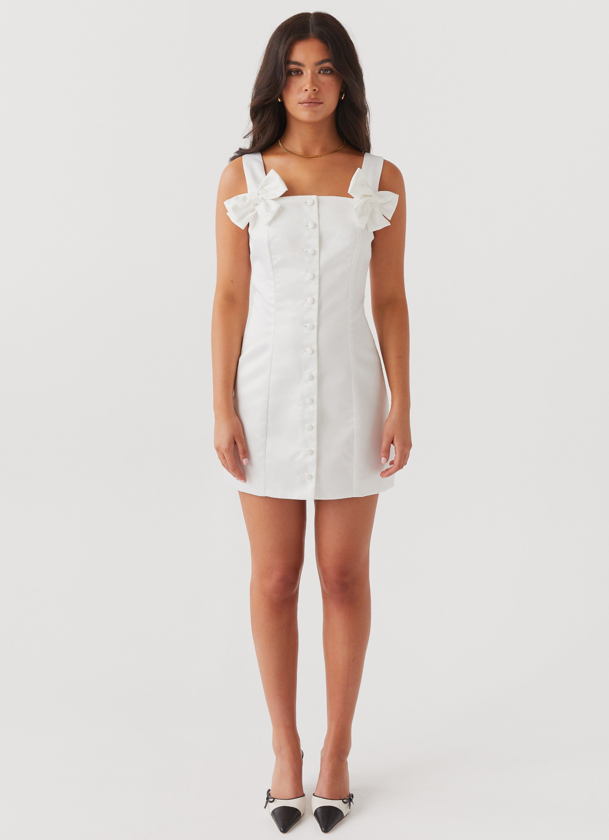 Womens Brielle Bow Satin Mini Dress in the colour White in front of a light grey background