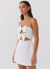 Womens Girl Crush Bow Mini Dress in the colour White in front of a light grey background