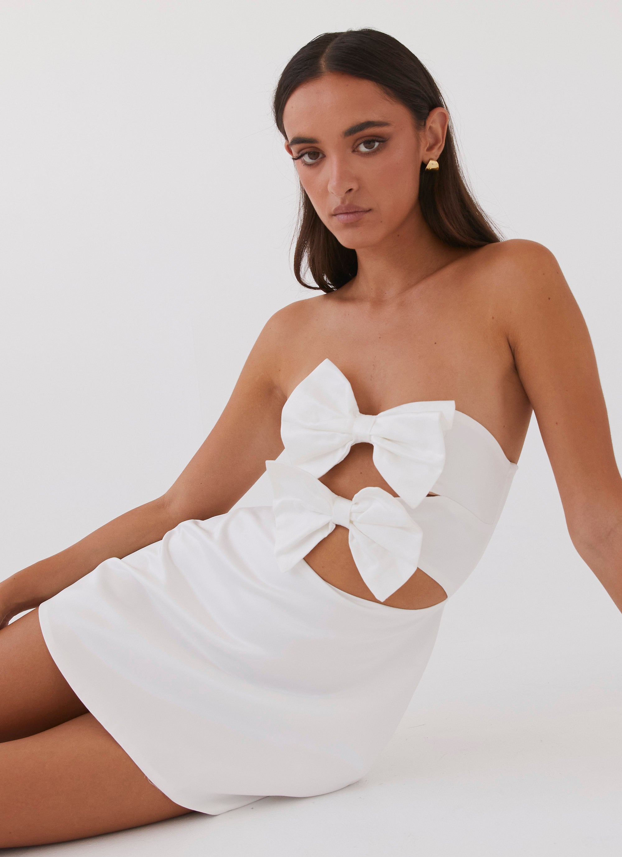 Womens Girl Crush Bow Mini Dress in the colour White in front of a light grey background
