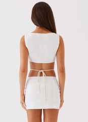 Womens Ryann Cut Out Mini Dress in the colour White in front of a light grey background