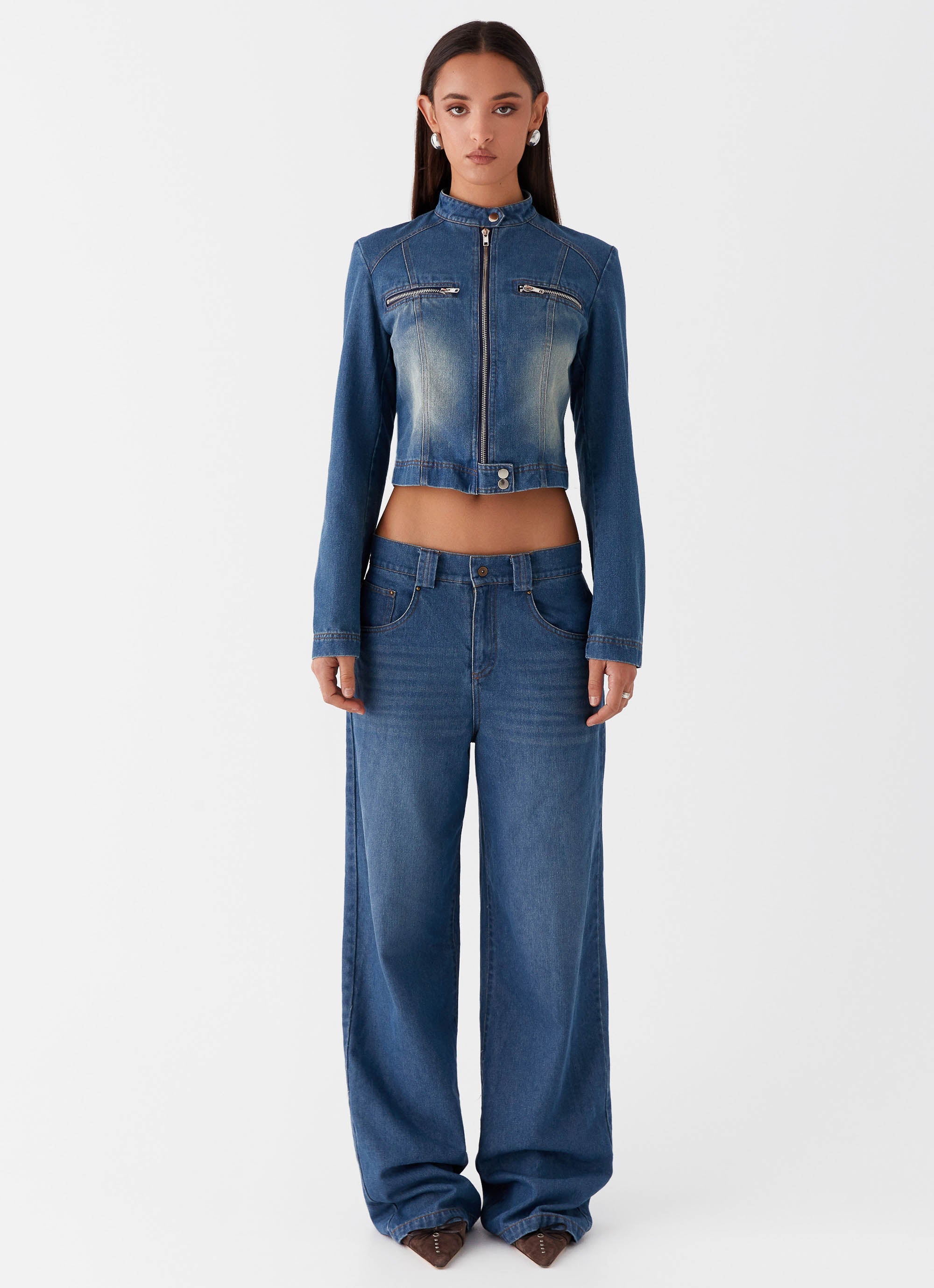 Womens Ride Elegant Baggy Jeans in the colour Vintage Blue Wash in front of a light grey background