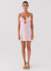 Womens Flora Linen Mini Dress in the colour Candy in front of a light grey background