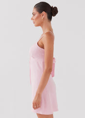 Womens Flora Linen Mini Dress in the colour Candy in front of a light grey background