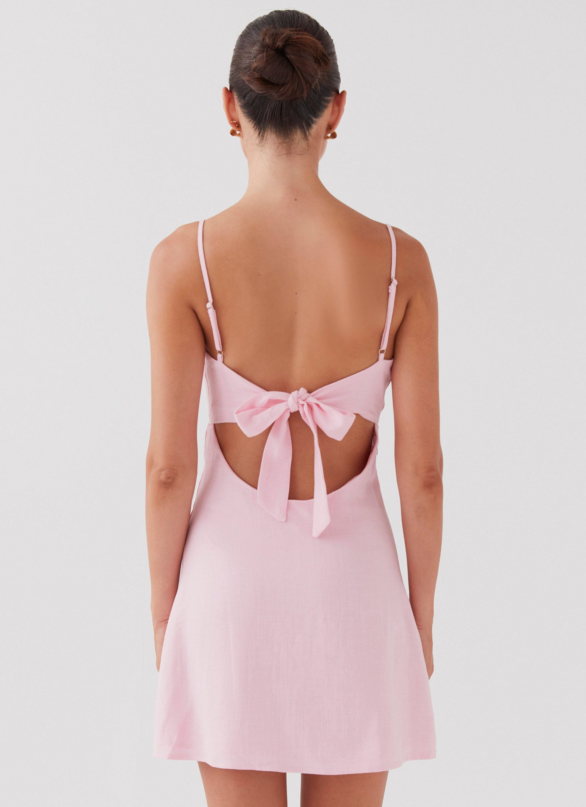 Womens Flora Linen Mini Dress in the colour Candy in front of a light grey background