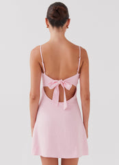 Womens Flora Linen Mini Dress in the colour Candy in front of a light grey background