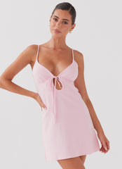 Womens Flora Linen Mini Dress in the colour Candy in front of a light grey background