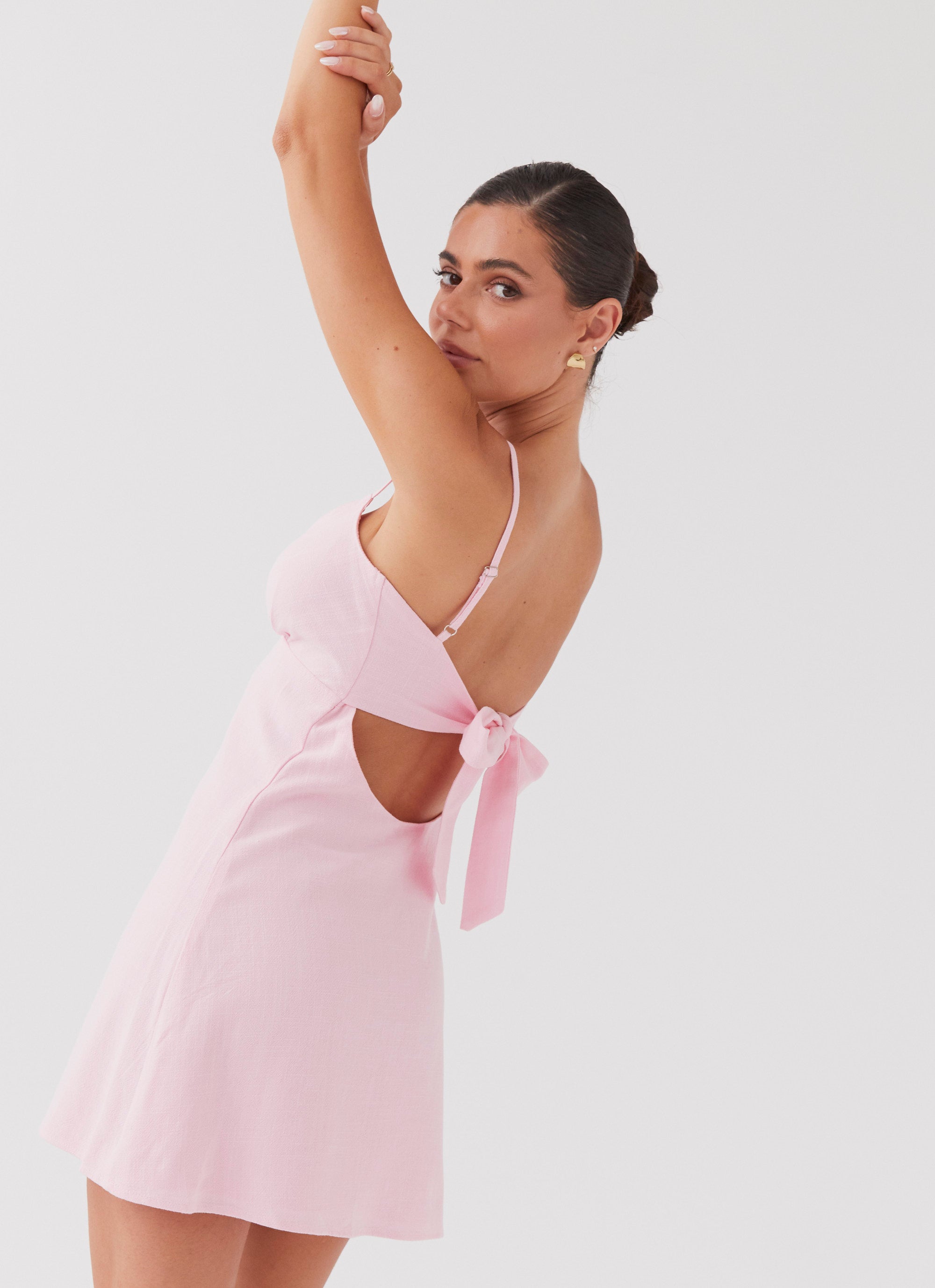 Womens Flora Linen Mini Dress in the colour Candy in front of a light grey background