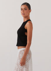 Womens Alice Cut Out Tank Top in the colour Black in front of a light grey background